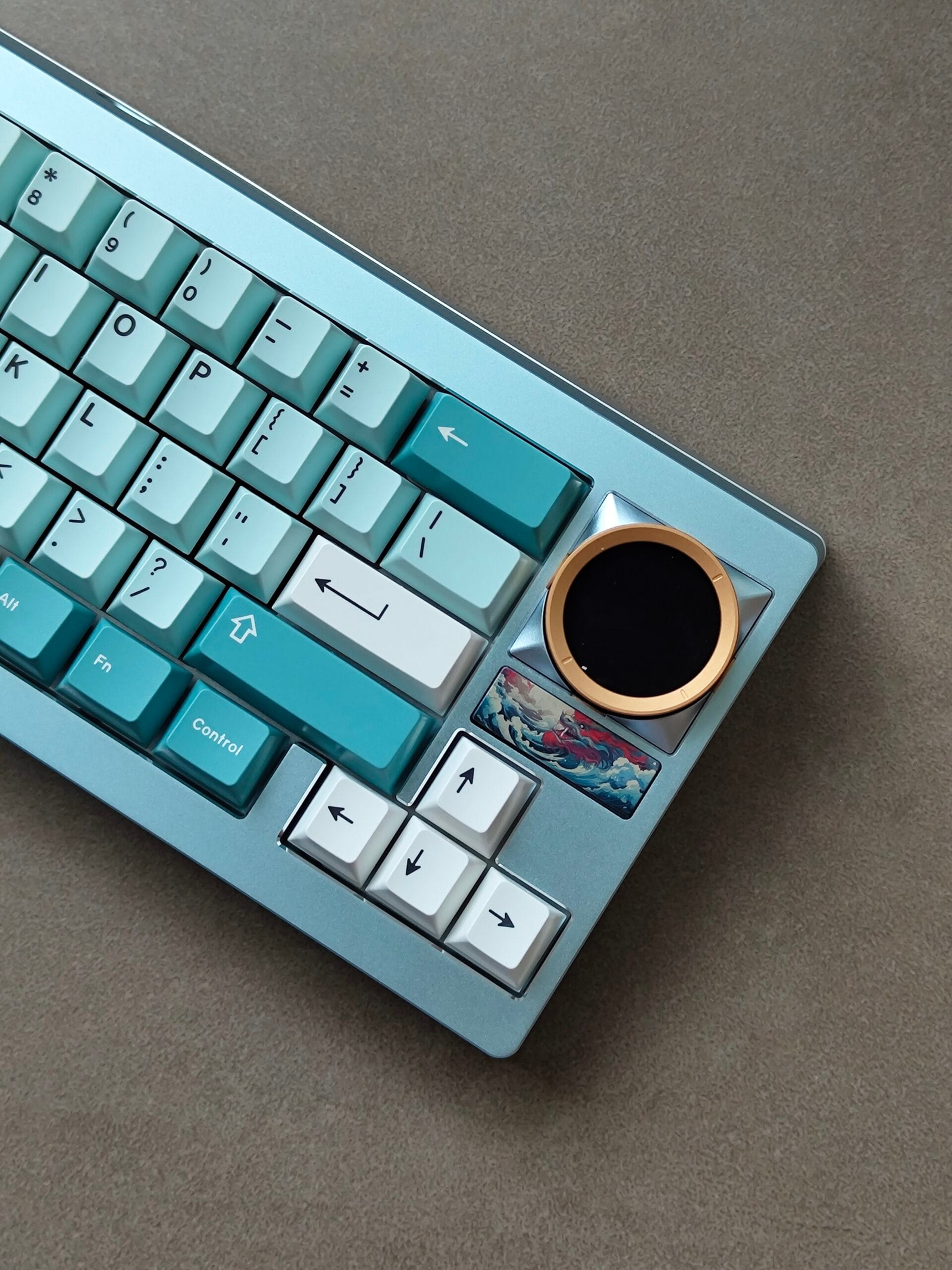 Teal keyboard with gold rotary knob