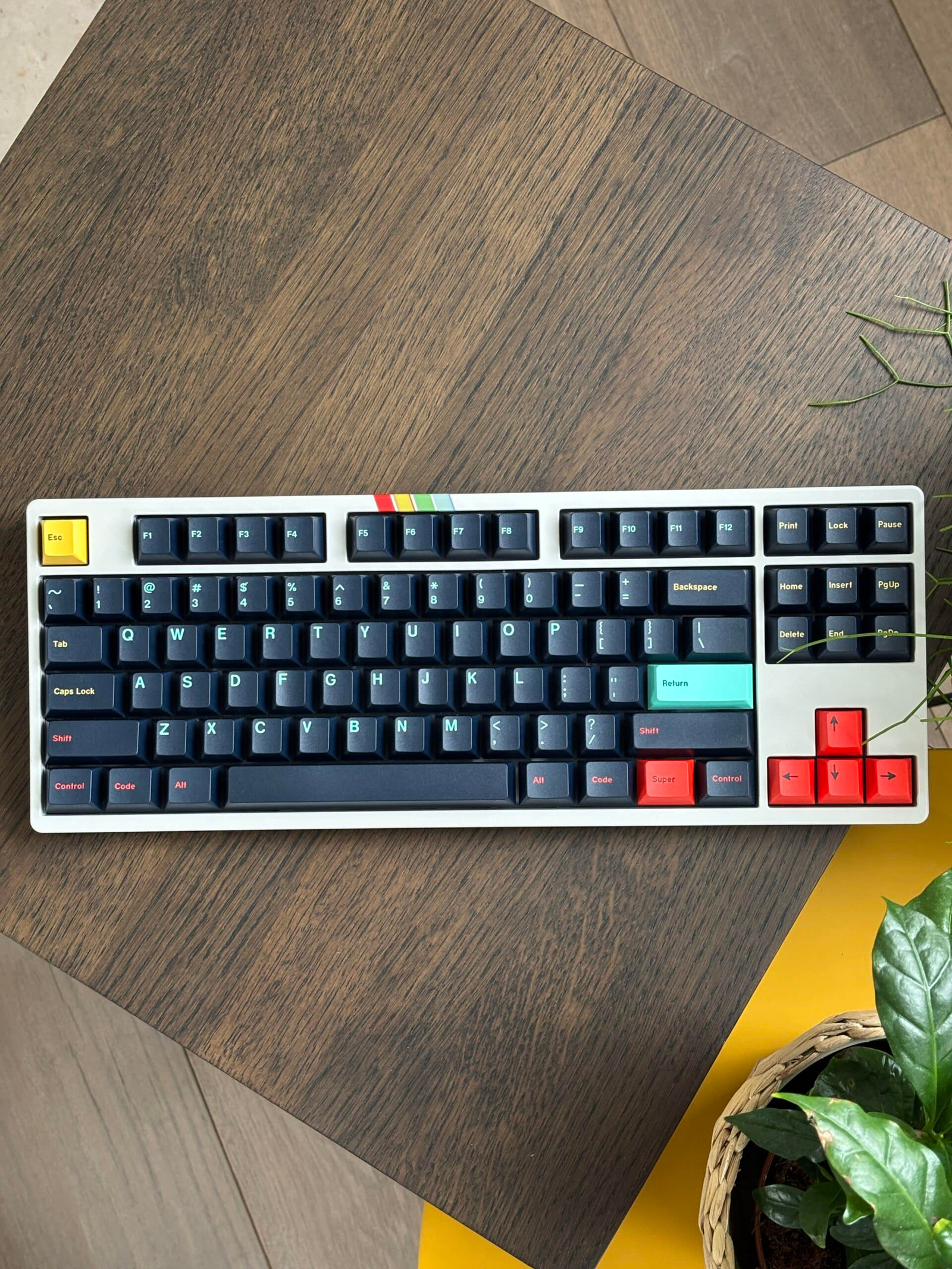 White and navy keyboard on a wooden floor